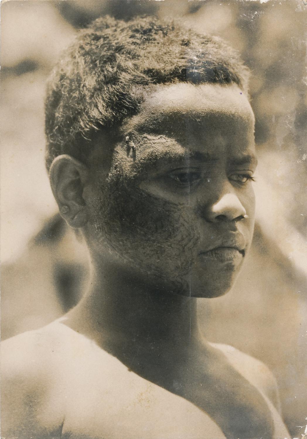 Boy showing Tattoo Face Solomon Islands