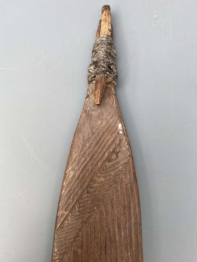 Aboriginal woomera with carved decoration